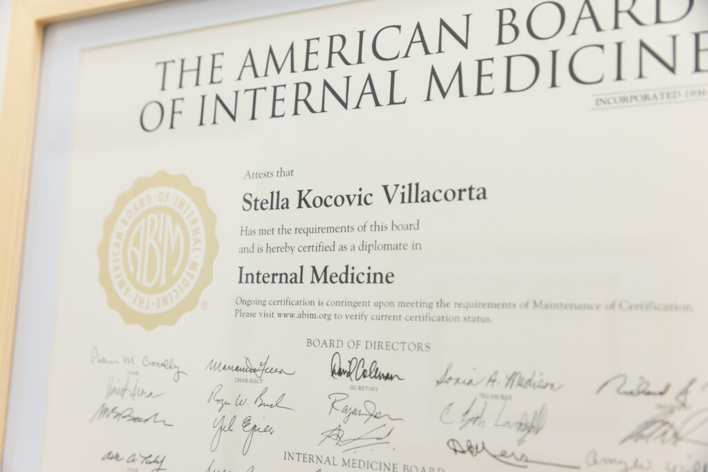 Dr. Stella Villacorta's framed medicine degree in her office at a women’s health clinic in Fort Lauderdale